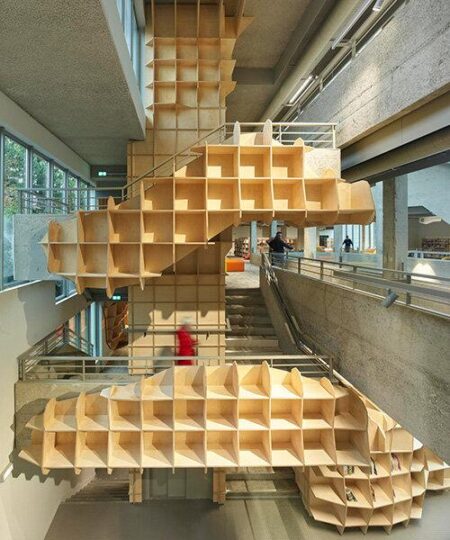 under the canopy: jakob+macfarlane reframes avignon library with undulating shelving – Designboom