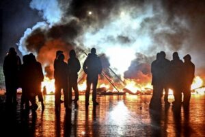 ‘My first barricade’: French protests unite teachers, gilets jaunes and students – The Guardian