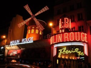 Moulin Rouge dancers perform cancan in Paris as the Tour De France comes to a close – AP News