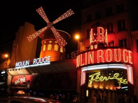 Moulin Rouge dancers perform cancan in Paris as the Tour De France comes to a close – AP News